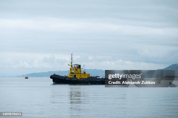 https://media.gettyimages.com/id/1409878653/photo/ocean-liner-or-sea-transport-fishing-vessel-entered-the-harbor-the-concept-of-shipping-sea.jpg?s=612x612&w=gi&k=20&c=U5tFPPXTUxv1dfM-3UuVBTVc9TqS6jV1PatiL_osF3Y=