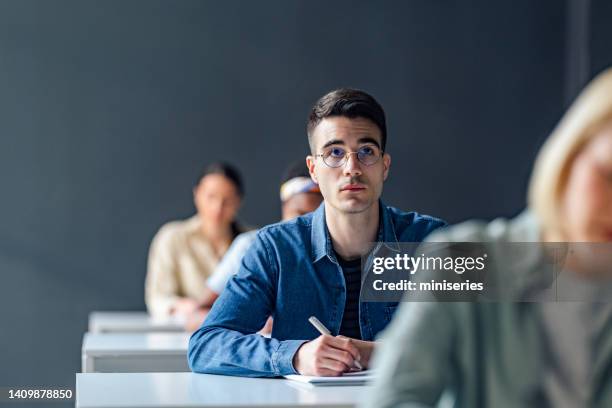 Reviewing Notes While Commuting Student Reviewing Notes Photos and Premium High Res Pictures - Getty Images