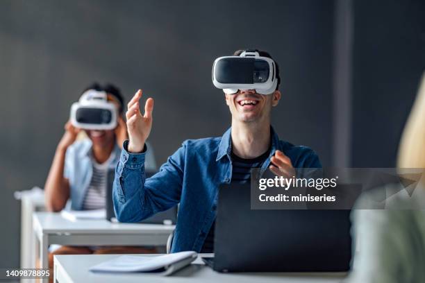 university students using virtual reality headset in the classroom - virtual library stock pictures, royalty-free photos & images