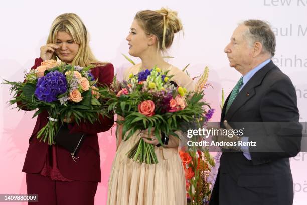 Corinna Schumacher, wife of former Formula One champion Michael Schumacher and her daughter Gina Schumacher with Jean Todt react at the awarding of...