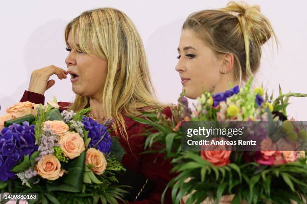 Corinna Schumacher, wife of former Formula One champion Michael Schumacher and her daughter Gina Schumacher react at the awarding of the North...