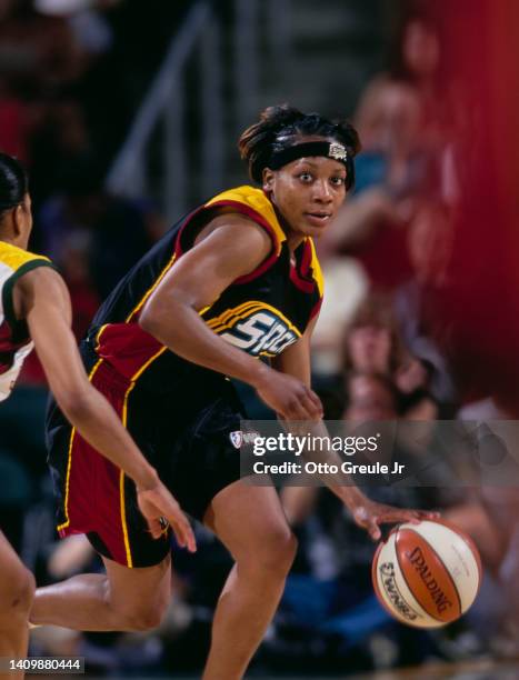 Dominique Canty, Guard for the Detroit Shock dribbles the basketball during the WNBA Western Conference basketball game against the Seattle Storm on...
