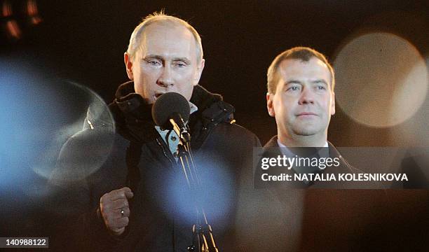 With tears in his eyes Russia's Prime Minister Vladimir Putin addresses his supporters during a rally at the Manezhnaya Square just outside the...