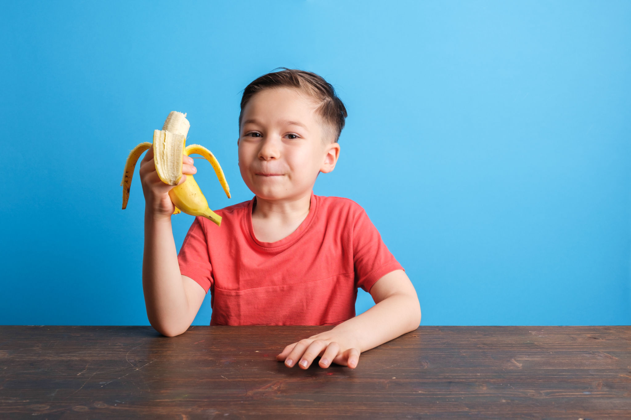 child eating fruit