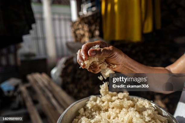 selective focus farmer hand-holding and pouring dried rice  in hand  the  global food crisis concept - fao stock pictures, royalty-free photos & images