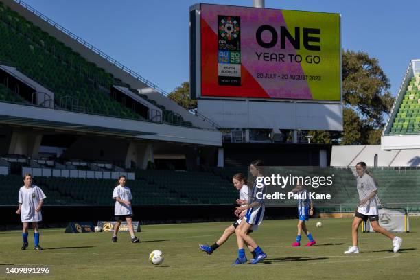 Junior players representing local clubs play football during the FIFA Women's World Cup 2023 'One Year To Go' event at Perth Rectangular Stadium on...