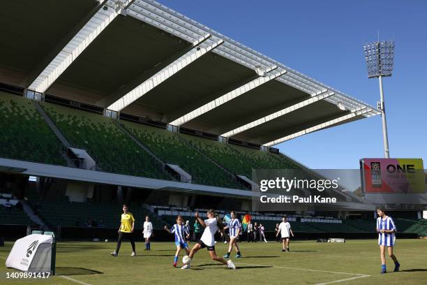 Junior players representing local clubs play football during the FIFA Women's World Cup 2023 'One Year To Go' event at Perth Rectangular Stadium on...