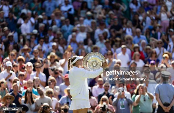 Elena Rybakina of Kazakhstan kissing the winners trophy after defeating Ons Jabeur of Tunisia in the Women's Singles Final at The Wimbledon Lawn...