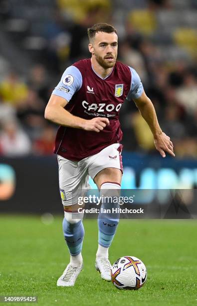 Calum Chambers of Aston Villa dribbles the ball during the 2022 Queensland Champions Cup match between Aston Villa and Brisbane Roar at Queensland...