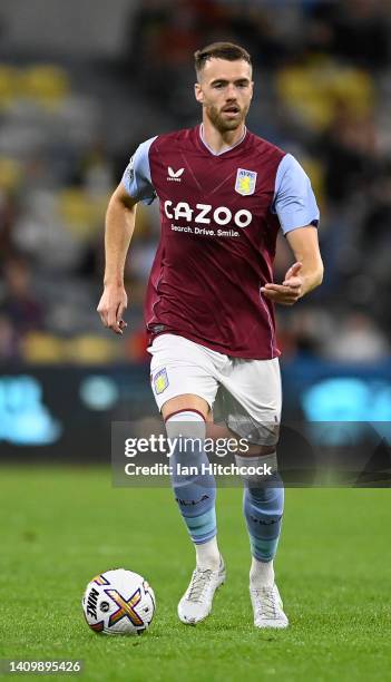 Calum Chambers of Aston Villa dribbles the ball during the 2022 Queensland Champions Cup match between Aston Villa and Brisbane Roar at Queensland...