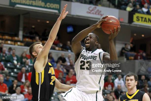 Draymond Green of the Michigan State Spartans drives for a shot attempt in the first half against the Iowa Hawkeyes during their quarterfinal game of...