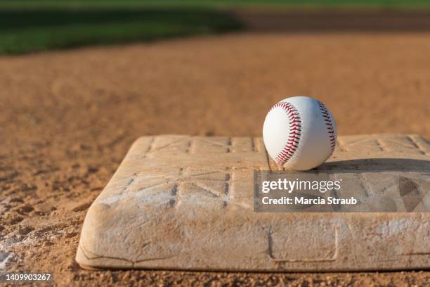 baseball on infield  base - baseball field background stock pictures, royalty-free photos & images