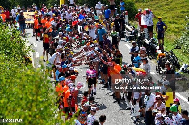 Owain Doull of United Kingdom and Team EF Education - Easypost competes climbing the Peyragudes while fans cheer during the 109th Tour de France...