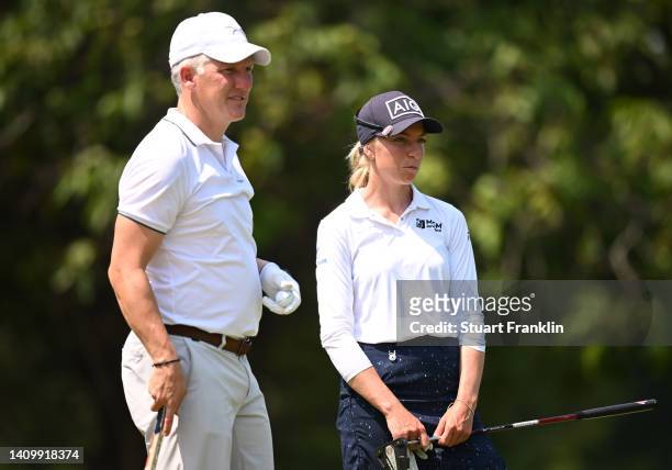 Former German international footballer Bastian Schweinsteiger and Sophia Popov of Germany prior to The Amundi Evian Championship at Evian Resort Golf...