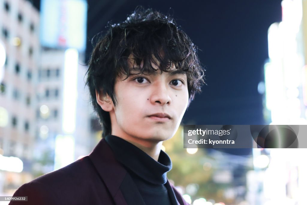 Portrait Of Young Asian Man At Night