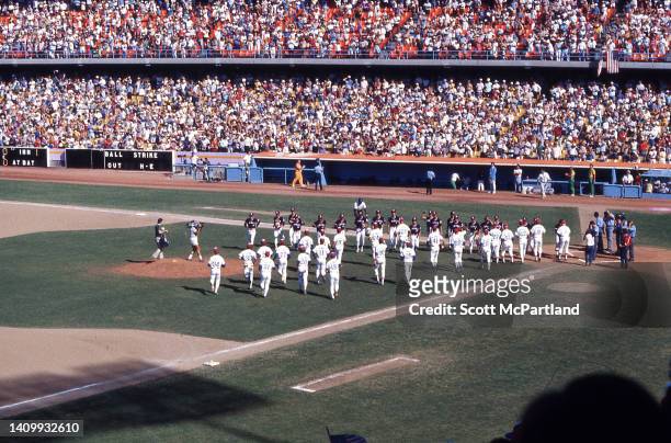 Baseball players representing the United States and South Korea gather together on the field at Dodger Stadium prior a game at the 1984 Summer...