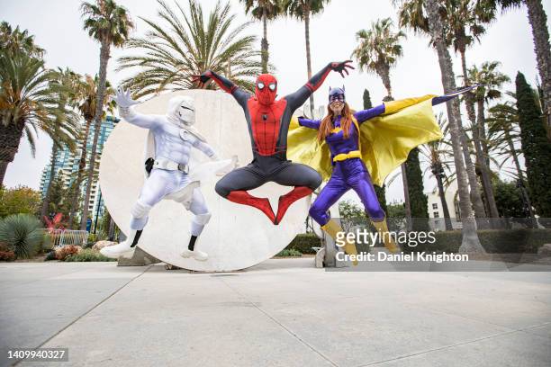 Cosplayers Derek Shackelton as Moon Knight, Jay Acey as Spiderman, and Nina Church as Batgirl attend a press conference to promote using public...