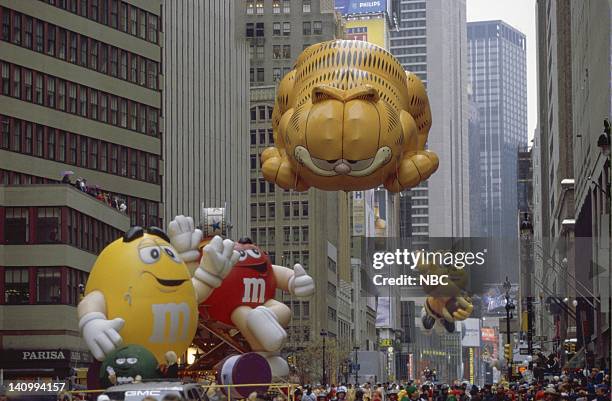 Pictured: The M&M's float with the Garfield balloon and the and the Honey Nut Cheerios Bee balloon in it's first appearance during the 1999 Macy's...