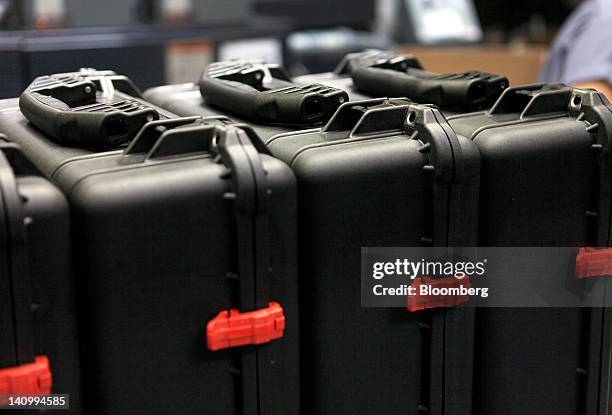 Fully assembled injection-molded plastic hardshell cases wait to be packaged before shipment at the Pelican Products Inc. Production facility in...