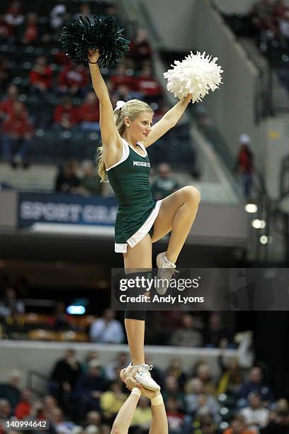 Cheerleader for the Michigan State Spartans performs against the Iowa Hawkeyes during their quarterfinal game of 2012 Big Ten Men's Basketball...