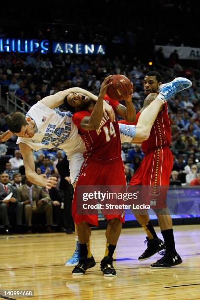 Tyler Zeller of the North Carolina Tar Heels fouls Sean Mosley of the Maryland Terrapins in the second half during the Quarterfinals of the 2012 ACC...