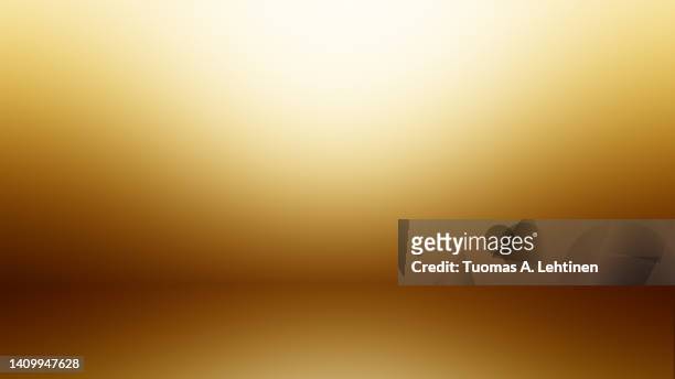 abstract and soft gold colored background - gold background stock-fotos und bilder