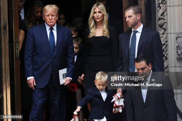 Former U.S. President Donald Trump and his kids Ivanka Trump and Eric Trump and their children follow the casket of Ivana Trump out of St. Vincent...