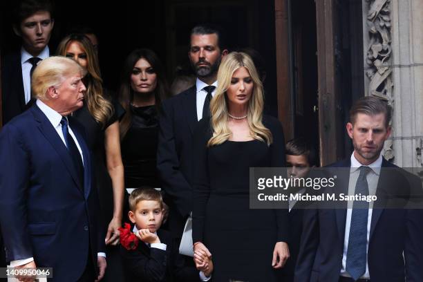 Former U.S. President Donald Trump and his kids Ivanka Trump, Eric Trump, and Donald Trump Jr. And their children follow the casket of Ivana Trump...
