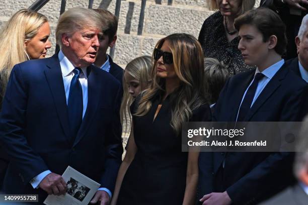 Former President Donald J. Trump, Melania Trump and Barron Trump exit the funeral of Ivana Trump at St. Vincent Ferrer Roman Catholic Church July 20,...