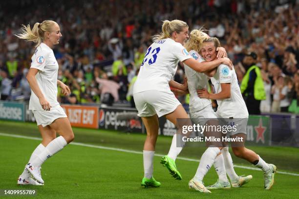 Ella Toone celebrates with teammates Chloe Kelly, Alessia Russo and Alex Greenwood of England after scoring their team's first goal during the UEFA...