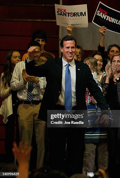 Republican presidential candidate, former U.S. Sen. Rick Santorum arrives on stage during a primary night party at the Steubenville High School...