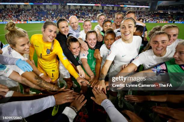 Players of England huddle following the UEFA Women's Euro 2022 Quarter Final match between England and Spain at Brighton & Hove Community Stadium on...