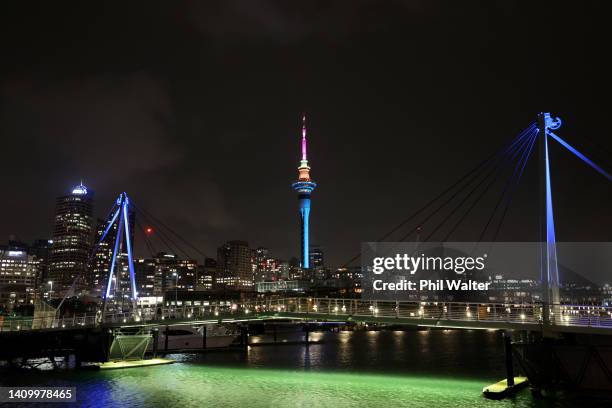 The Auckland Sky Tower and the Viaduct Harbour pictured lit up during the FIFA Women's World Cup 'One Year To Go' event on July 20, 2022 in Auckland,...