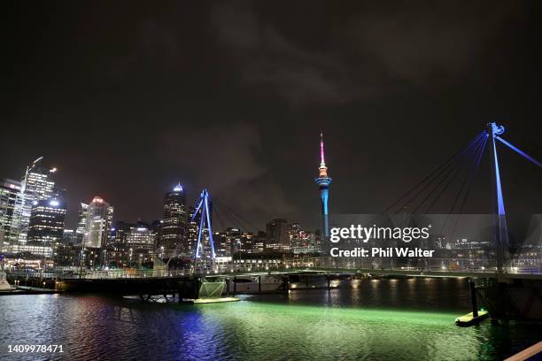 The Auckland Sky Tower and the Viaduct Harbour pictured lit up during the FIFA Women's World Cup 'One Year To Go' event on July 20, 2022 in Auckland,...