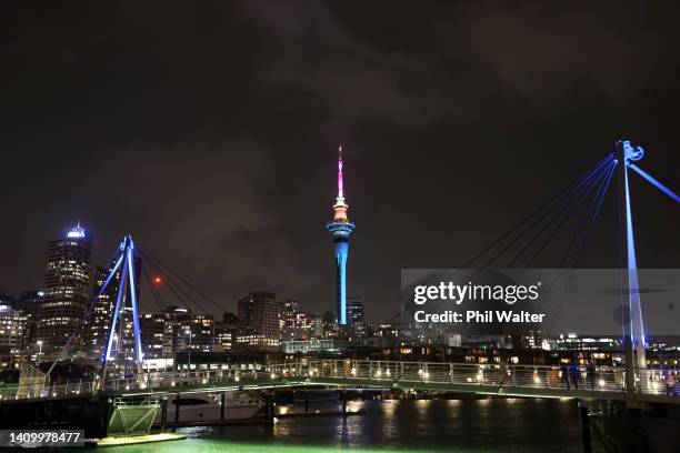 The Auckland Sky Tower and the Viaduct Harbour pictured lit up during the FIFA Women's World Cup 'One Year To Go' event on July 20, 2022 in Auckland,...