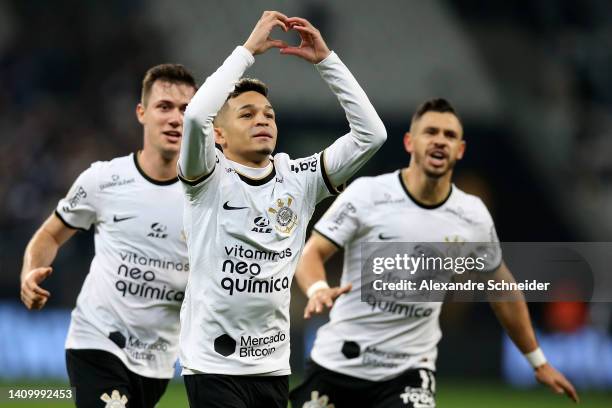 Adson of Corinthians celebrates with teammates after scoring the second goal of his team during a match between Corinthians and Coritiba as part of...