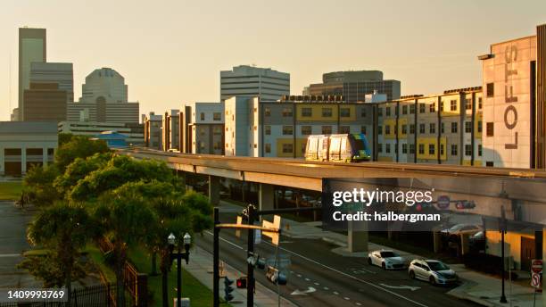 drone shot of train in downtown jacksonville, florida - jacksonville stock pictures, royalty-free photos & images