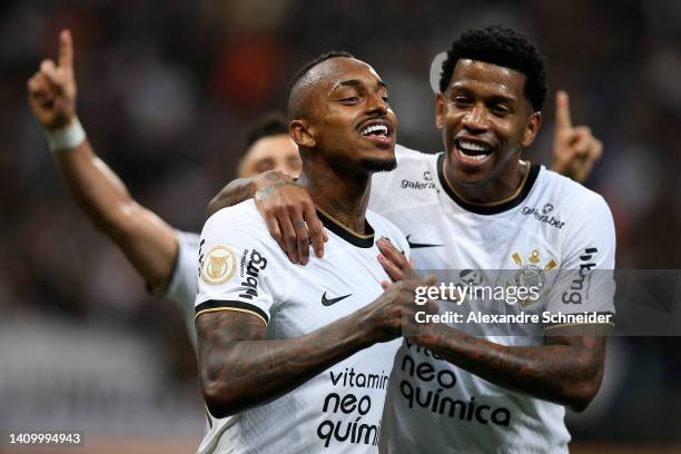 Raul Gustavo of Corinthians celebrates with teammate after scoring the third goal of his team during a match between Corinthians and Coritiba as part...