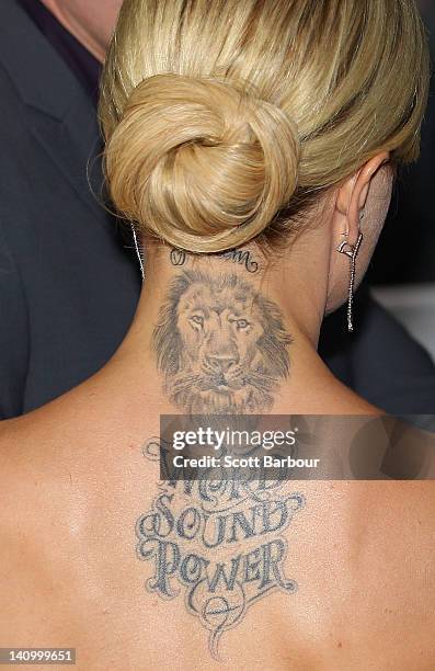 Tattoo is seen on the back of Mena Suvari as she arrives at the Australian premiere of "American Pie: Reunion" on March 7, 2012 in Melbourne,...