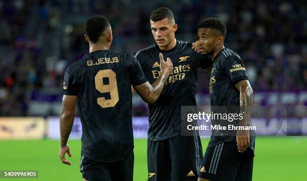 Gabriel Jesus, Granit Xhaka, and Reiss Nelson of Arsenal celebrate winning a Florida Cup friendly against the Orlando City at Exploria Stadium on...