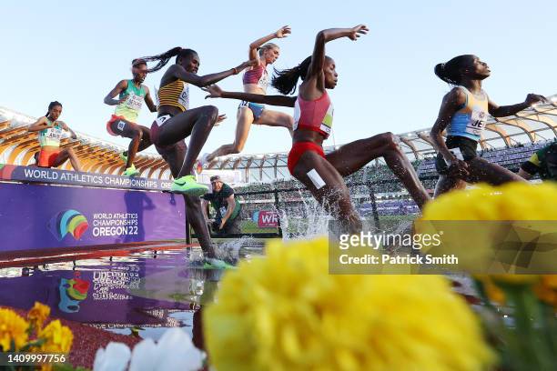 Peruth Chemutai of Team Uganda and Emma Coburn of Team United States compete in the Women's 3000m Steeplechase Final on day six of the World...
