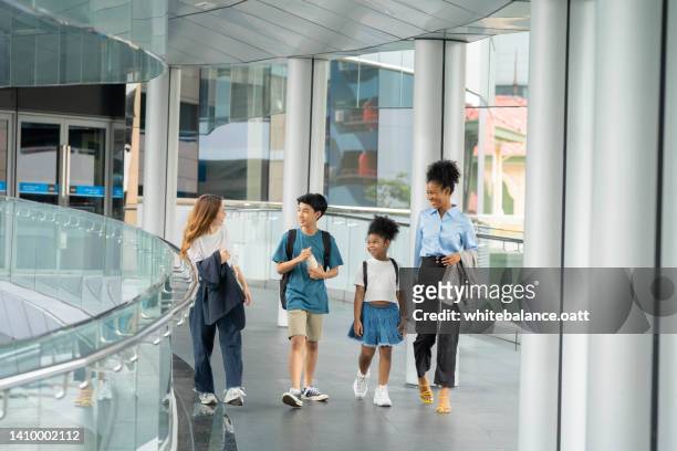 children and mature greet each other in the morning. - generation gap stock pictures, royalty-free photos & images