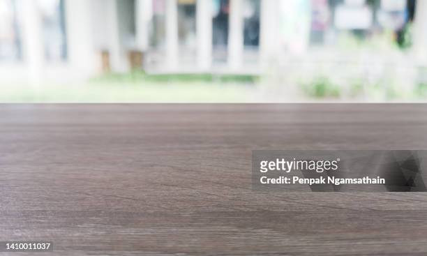 brown wooden table empty display your product on blurred of shop background - köksbänk bildbanksfoton och bilder