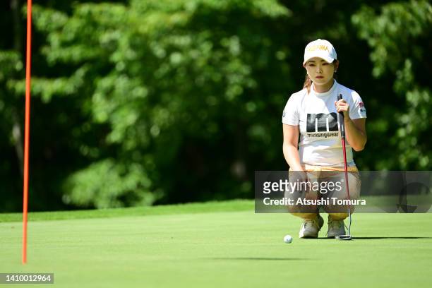 Momo Yoshikawa of Japan lines up a putt on the 12th green during the first round of Daito Kentaku eHeyanet Ladies at Takino Country Club on July 21,...