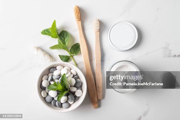 zero waste dental, bamboo toothbrushes, toothpaste in jar, tablets, floss - charcoal toothpaste stock pictures, royalty-free photos & images