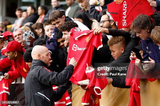 Erik ten Hag, manager of Manchester United signs autographs during a Manchester United training session at the WACA on July 21, 2022 in Perth,...