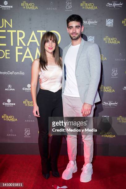 Ivonne Zurita and Nahuel Escobar pose for a photo on the red carpet during the premiere of "Un Retrato De Familia" at Cinemex Antara Polanco on July...