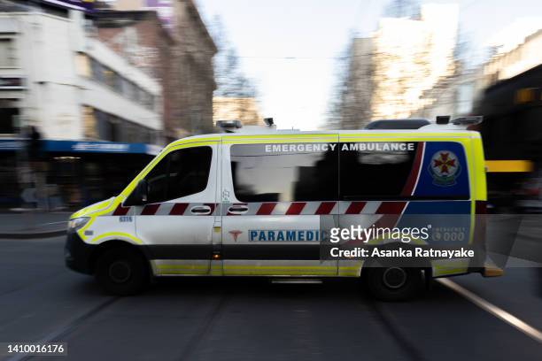 An ambulance drives through the CBD on July 21, 2022 in Melbourne, Australia. Victoria recorded 14,312 official cases of COVID-19 in the last 24-hour...