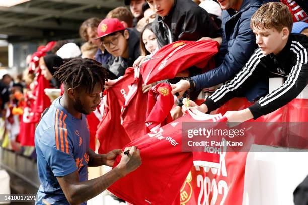 Fred of Manchester United signs autographs during a Manchester United training session at the WACA on July 21, 2022 in Perth, Australia.