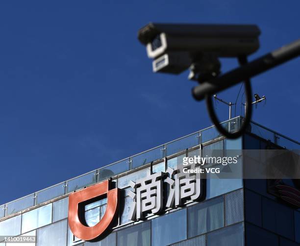 Logo of Chinese ride-hailing platform Didi Chuxing is displayed atop its headquarters building on January 12, 2022 in Beijing, China.
